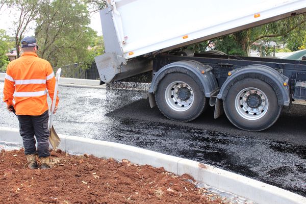Nexpave truck laying asphalt and bitumen.