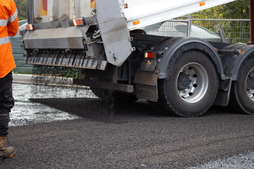 Nexpave truck laying asphalt and bitumen.